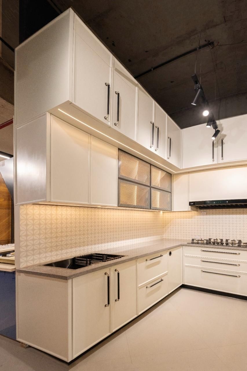 Ddesignery modular kitchen showroom in Gurgaon – L-shaped kitchen with premium laminates