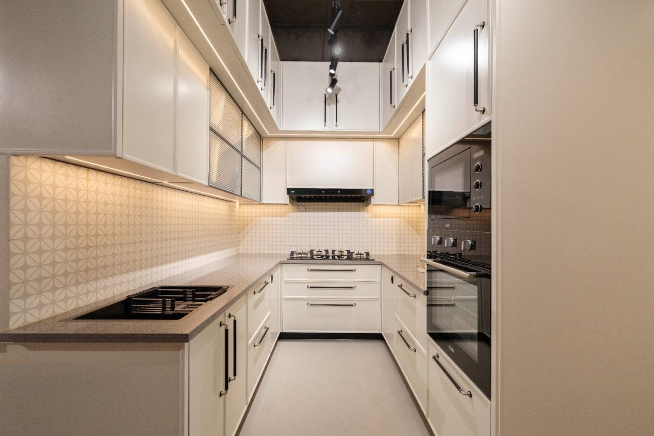 Ddesignery modular kitchen showroom in Gurgaon – L-shaped kitchen with premium laminates